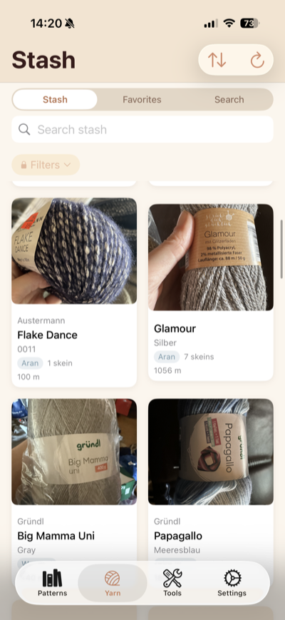 Yarn stash view showing a grid of yarn skeins with brand names, colorways, weight categories, and remaining quantities